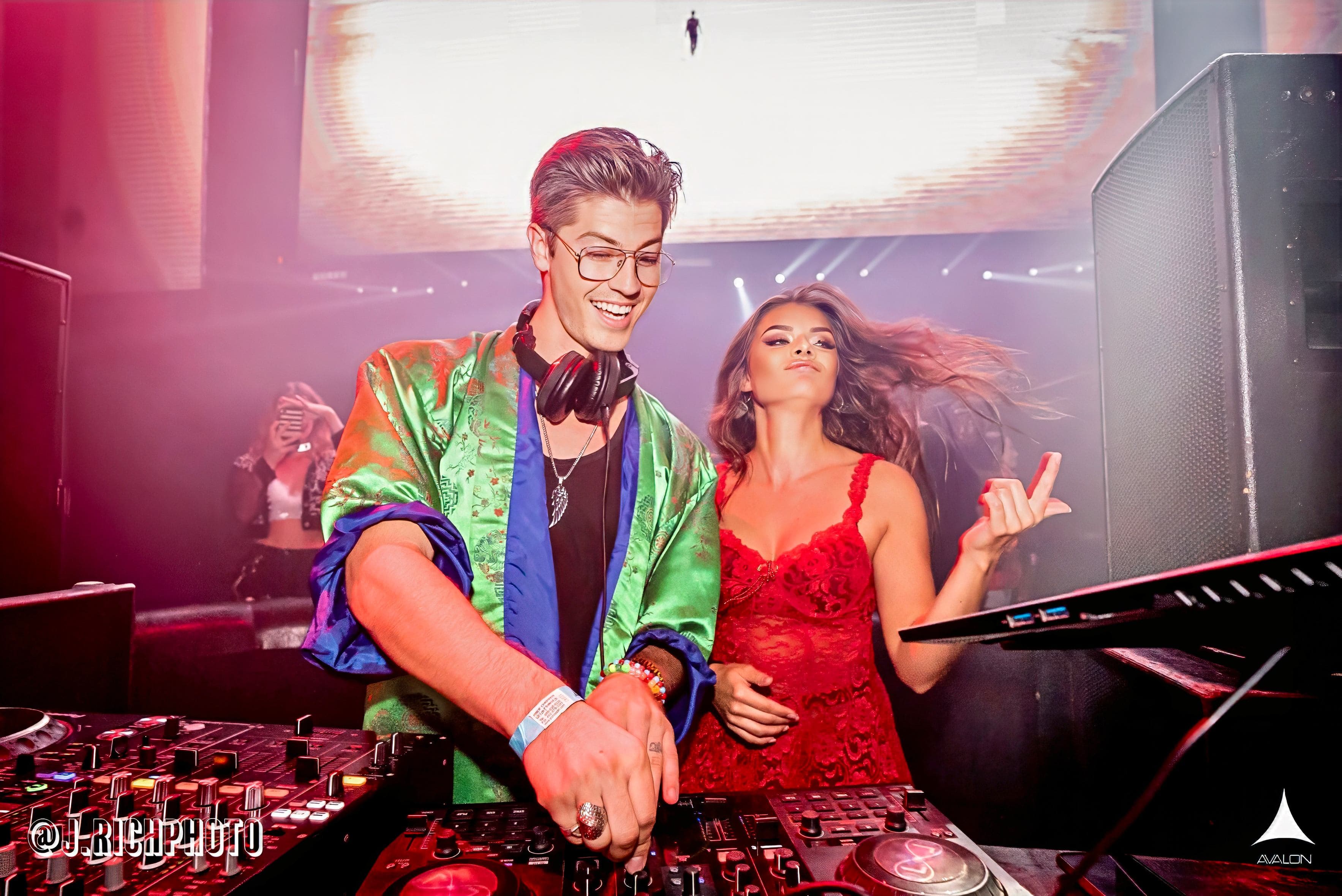 DJ Liquid Light performing in a vivid live venue environment.